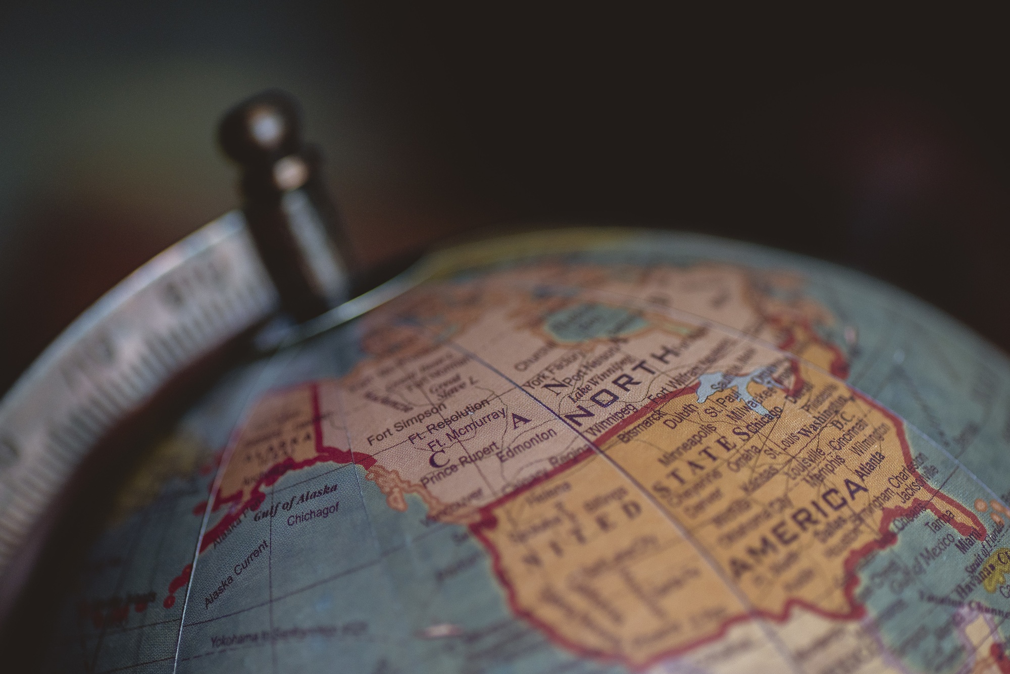 Closeup shot of continents on the globe with a blurred background