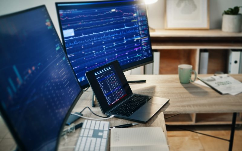 Laptop, computer screen and stock exchange statistics of investment data, trading market analytics